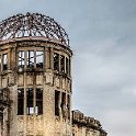 054 FacebookHeader JPN Hiroshima 2012NOV05 PeaceMemorialDome 008  This prominent landmark is both famous and infamous. It's the Hiroshima A-Bomb Dome (Gembaku Domu).    The building was once a striking building, on a grand scale and used by the government. The site is now a World Heritage Site river.    For me, I like the contrasting starkness of the skeletal building with the seemingly brooding clouds that are all dark and grey. — in Hiroshima, Hiroshima Prefecture, Japan : 2012, 2012 Fukuoka Golden Oldies, Alice Springs Dingoes Rugby Union Football CLub, Asia, Date, Golden Oldies Rugby Union, Hiroshima, Japan, Month, November, Peace Memorial Dome, Places, Rugby Union, Sports, Year